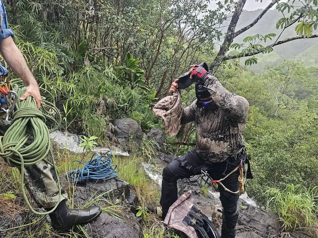 Ropes and rigging laid out at the top of a waterfall