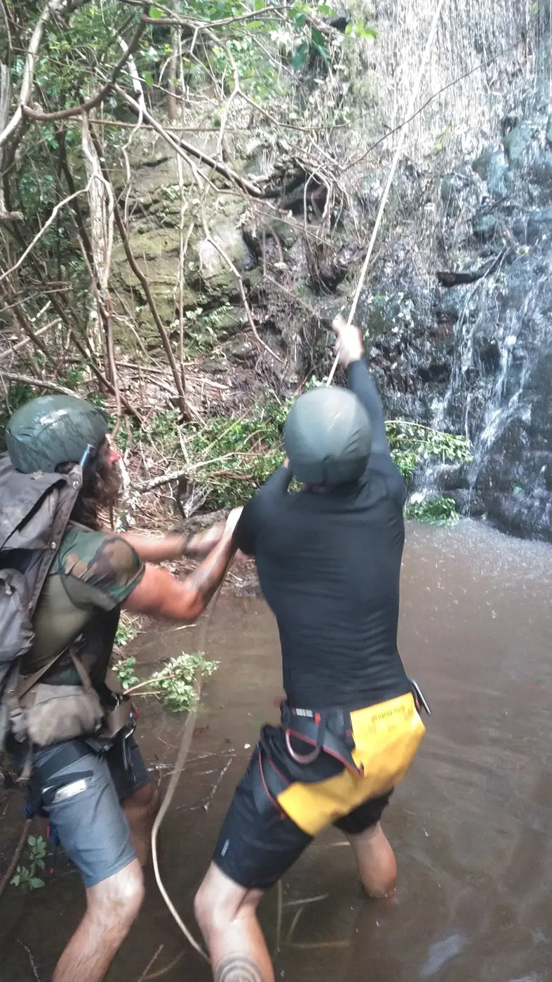 Rope assist practice in a waterfall pool