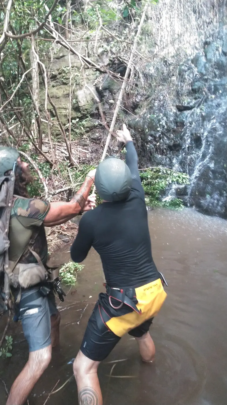 Belay and assist training in a waterfall pool